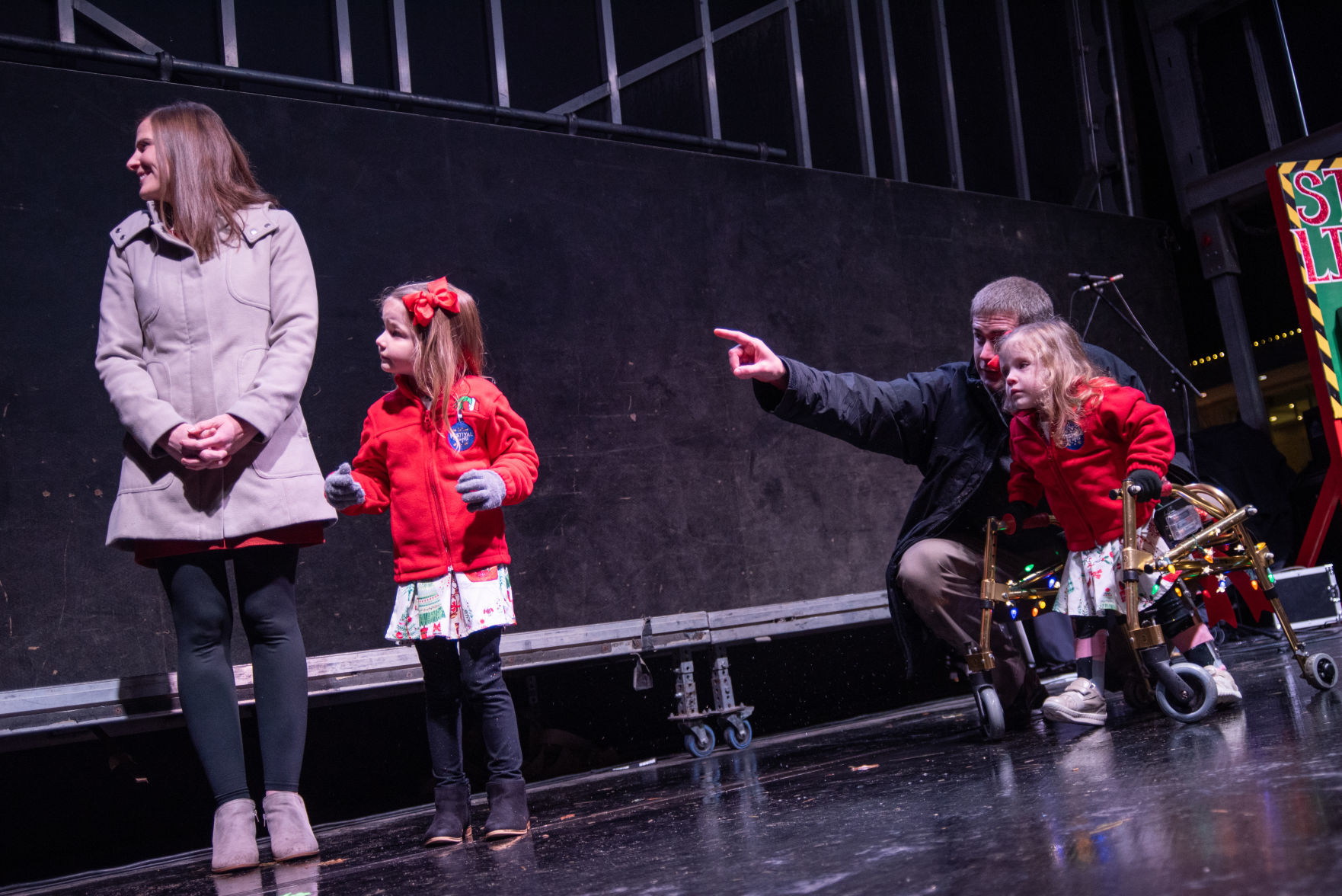 Allison Herrman, Lydia Herrman, Eric Herrman and Faith Herrman look up at Santa Clause